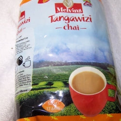 Melvins Tangawizi Chai 500g front label with cup of ginger chai and Kenyan highland tea estate background