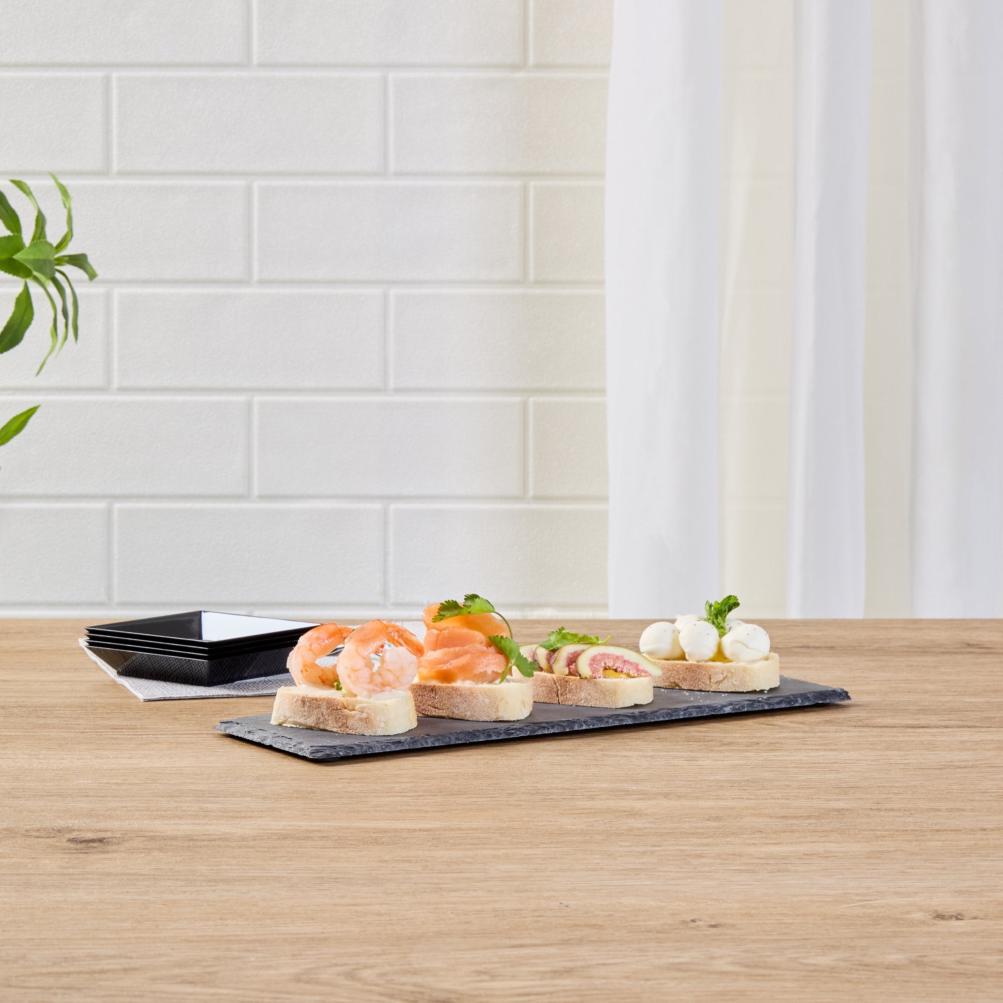 Stone Tek Rectangle Black Slate Serving Tray - 11 3/4" x 4" - 4 count box