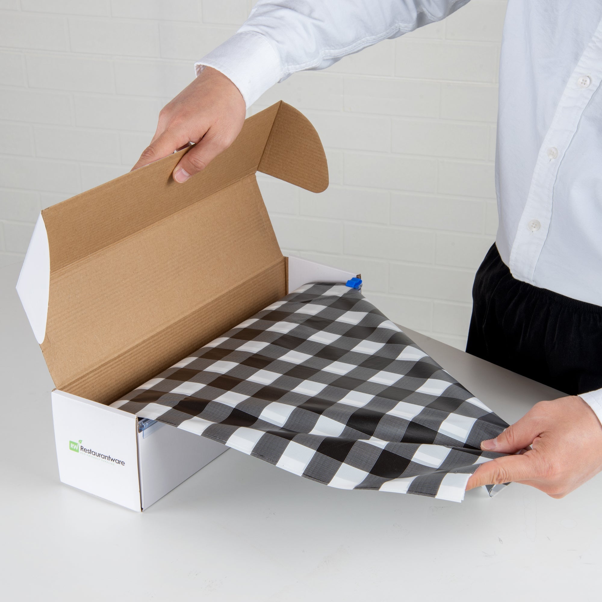 Table Tek Black Gingham Plastic Table Cover Roll - with Slide Cutter - 100' x 54" - 1 count box
