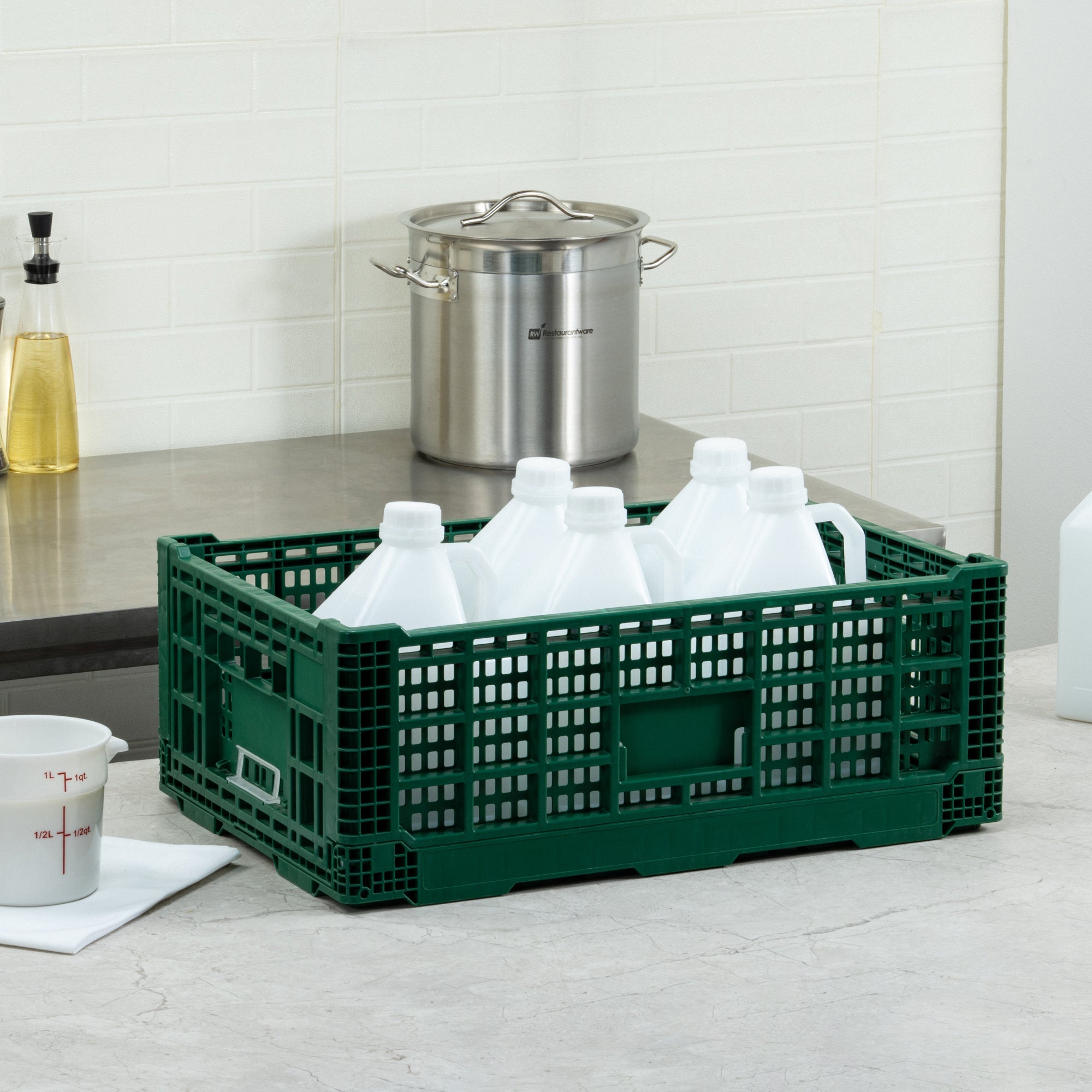 Cater Tek Rectangle Green Plastic 36L Collapsible Milk Crate - Stackable - 23 1/2" x 15 3/4" x 8 1/2" - 1 count box