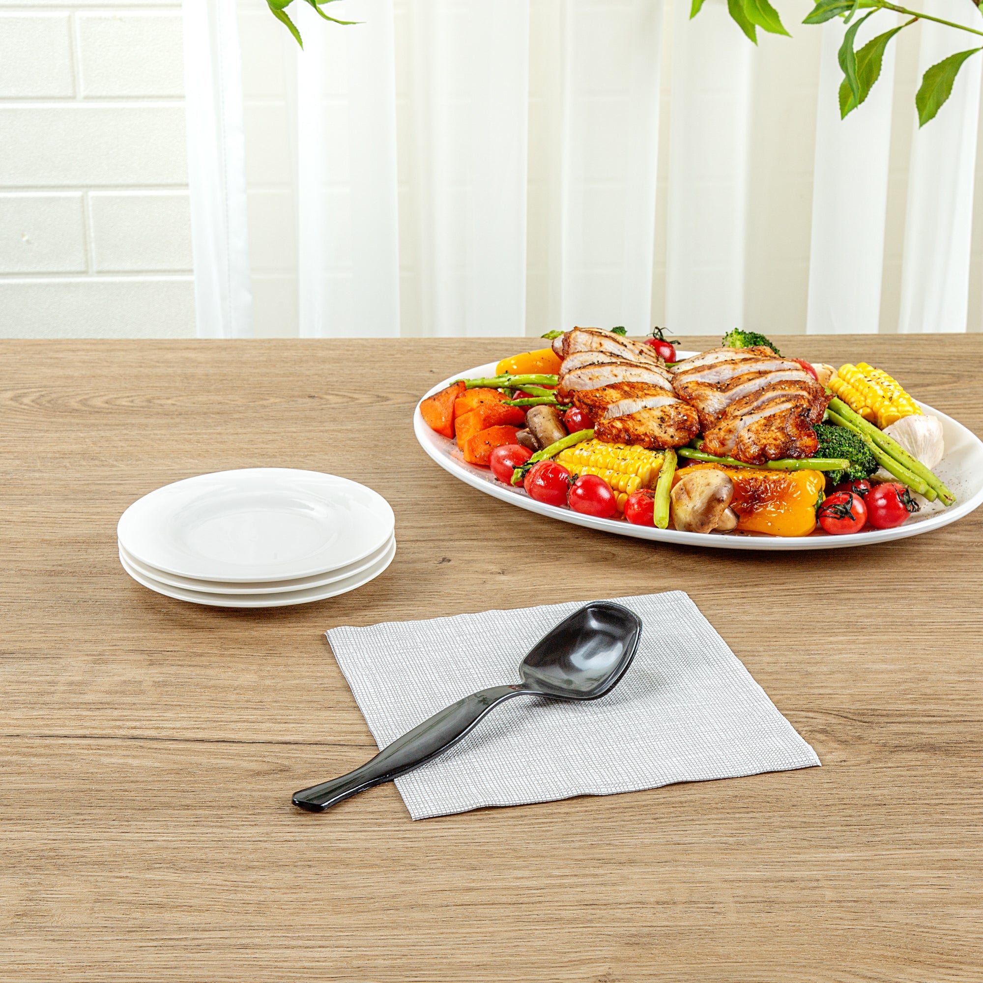 Cater Tek Black Plastic Serving Spoon - 8 1/2" - 100 count box