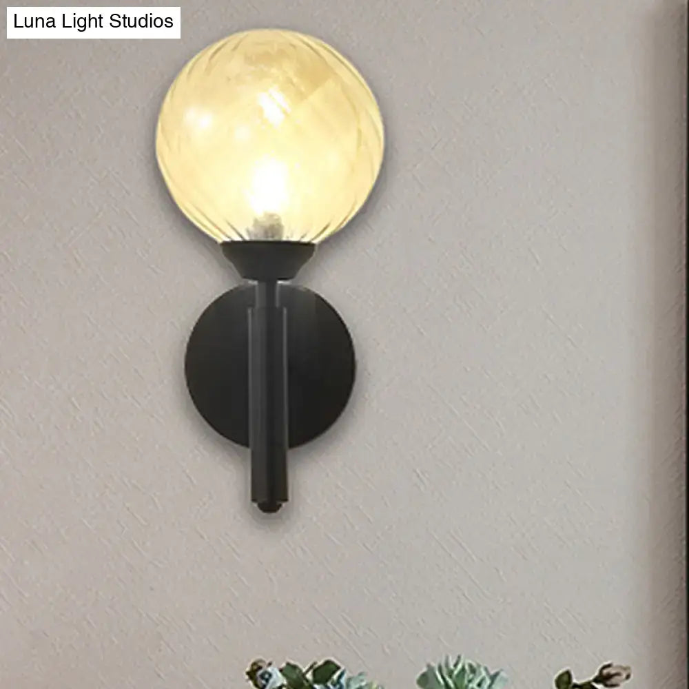 Modern black wall sconce with clear textured glass – bedroom light