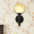Modern black wall sconce with clear textured glass – bedroom light