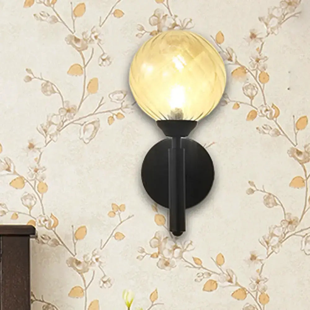 Modern black wall sconce with clear textured glass – bedroom light