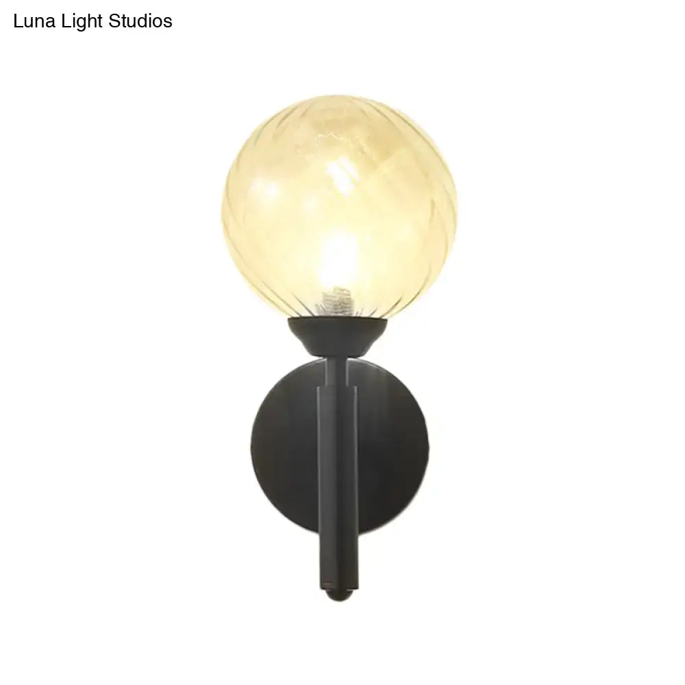 Modern black wall sconce with clear textured glass – bedroom light