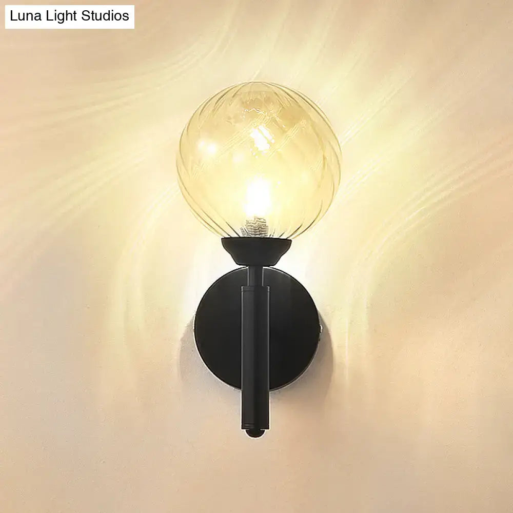 Modern black wall sconce with clear textured glass – bedroom light