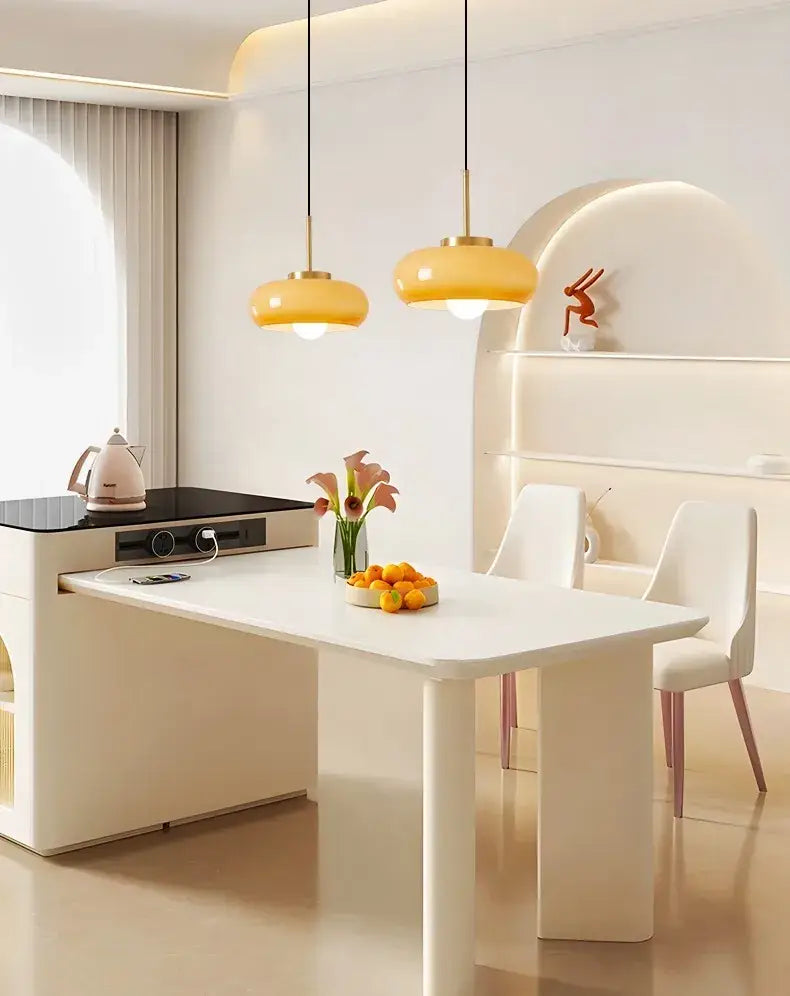 Sleek amber glass and copper pendant light for kitchens