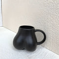 Playful white speckled butt shape ceramic coffee cup kitchen decor