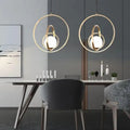 Modern rotating gold ring pendant light bedroom frosted glass globe