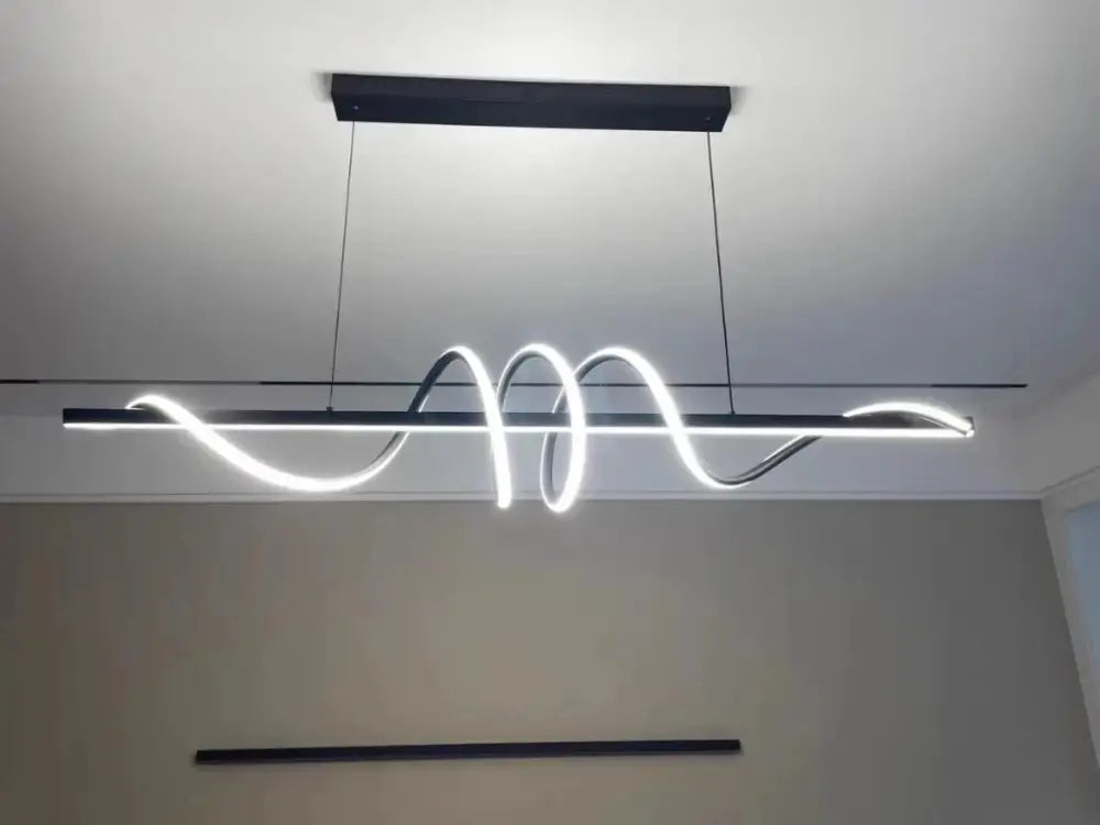 Sleek wavy pendant lights for dining room with brushed metallic finish