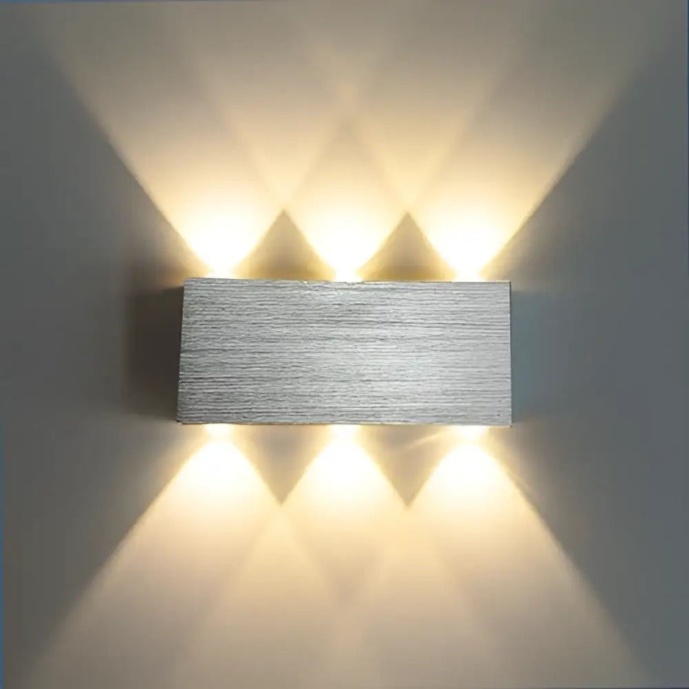 Modern brushed silver sphera wall sconces bedroom warm light beam