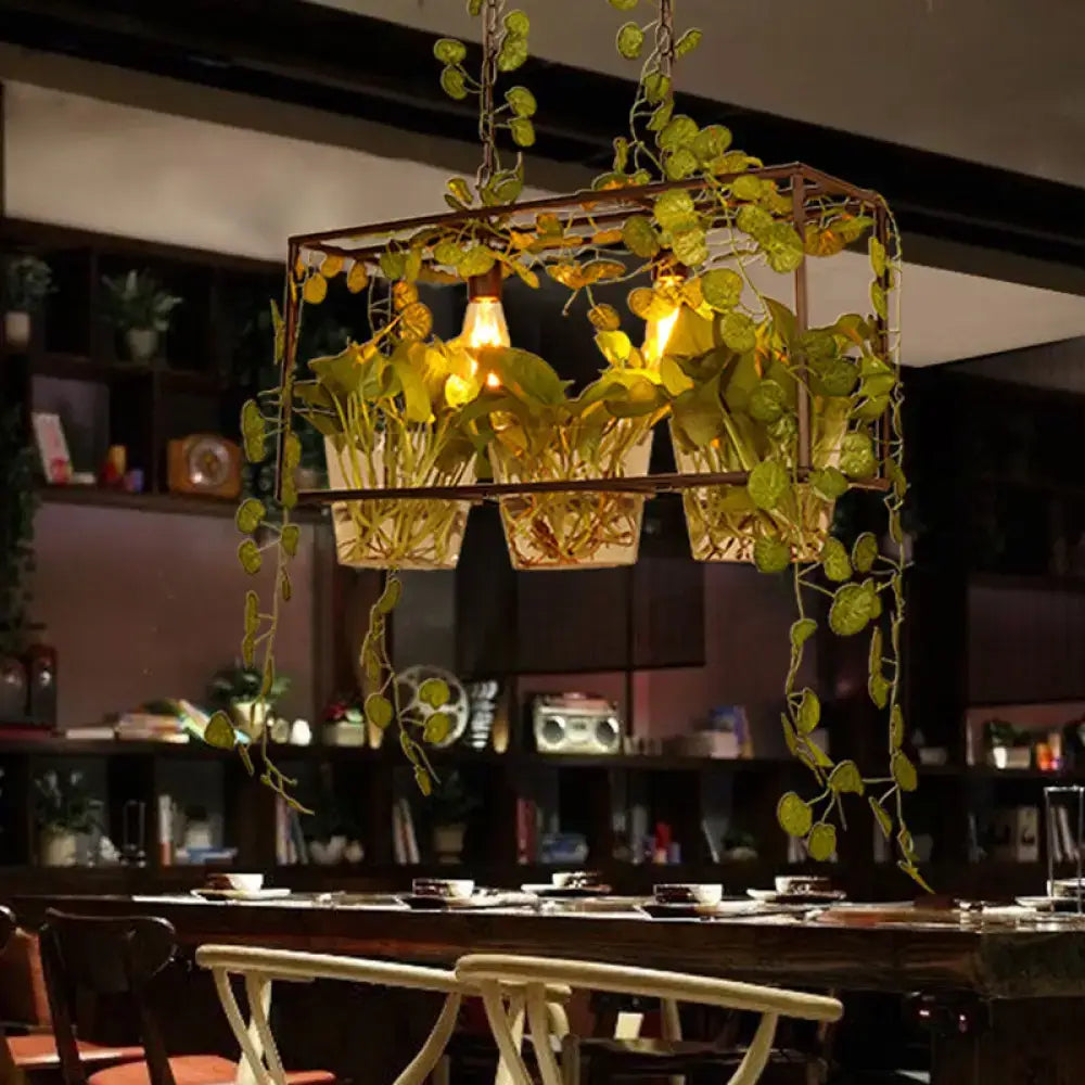 Industrial black island pendant light with potted plant dining room