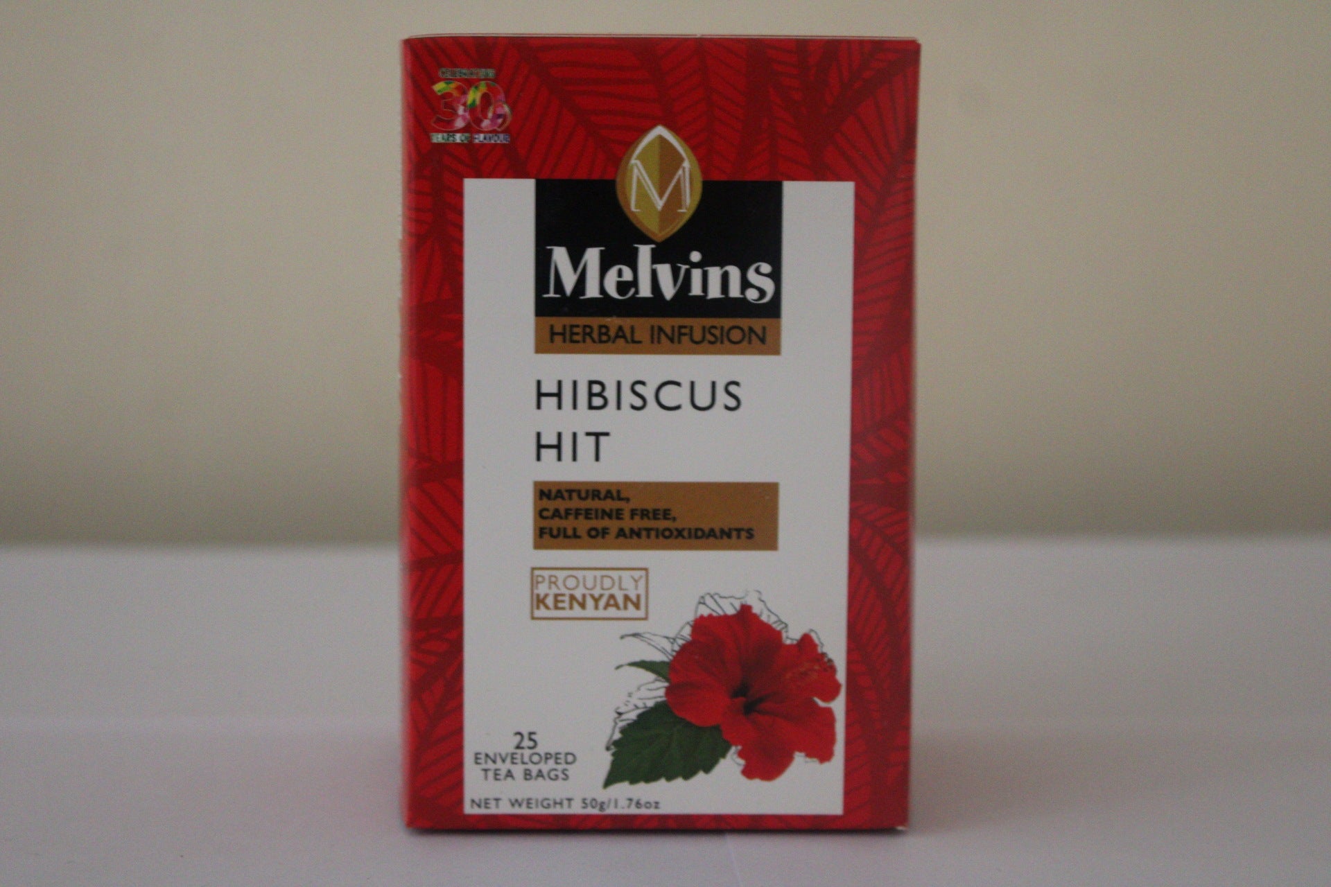 Melvins Hibiscus Hit caffeine free herbal tea box front rotated view 25 individually wrapped tea bags