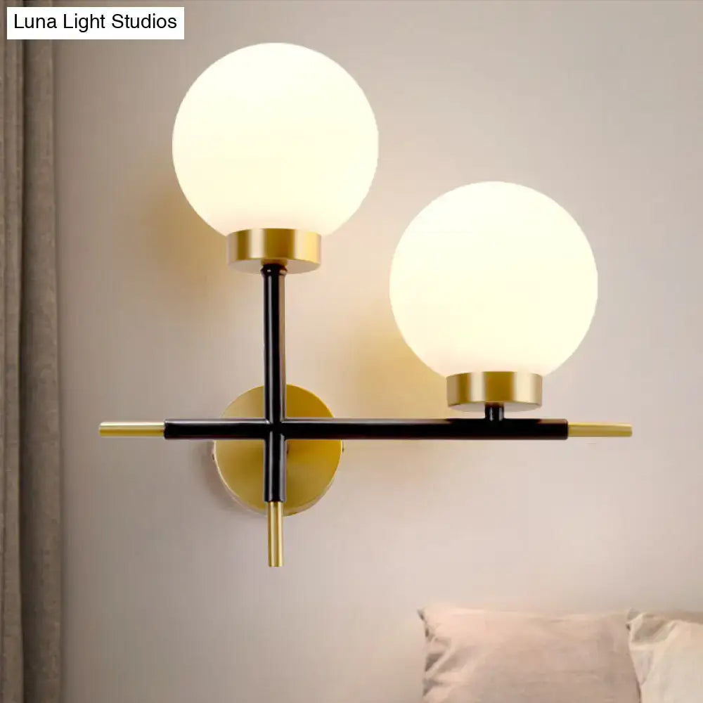 Post-modern white and brass sphere wall sconce bedroom light