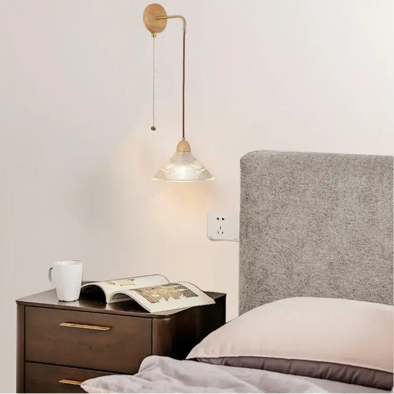 Rustic wood and brass wall light with clear glass pull chain switch